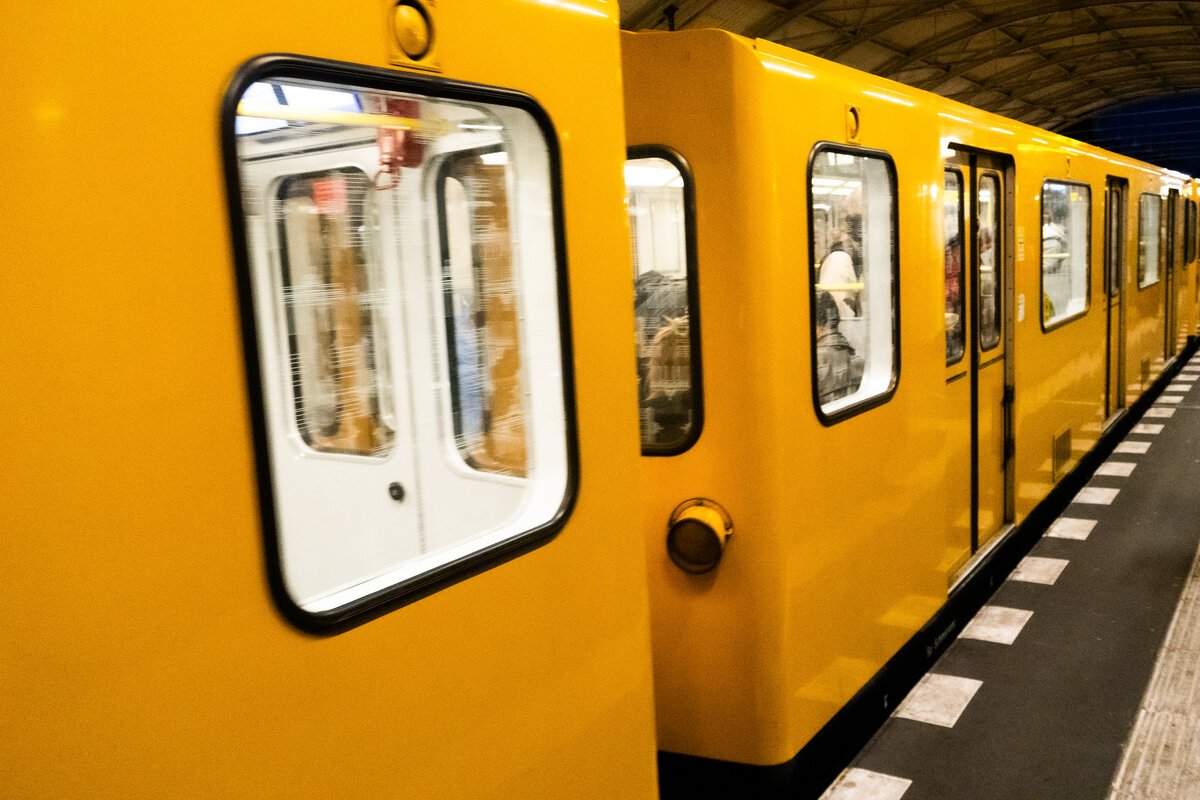 yellow Berlin U-Bahn subway train at platform